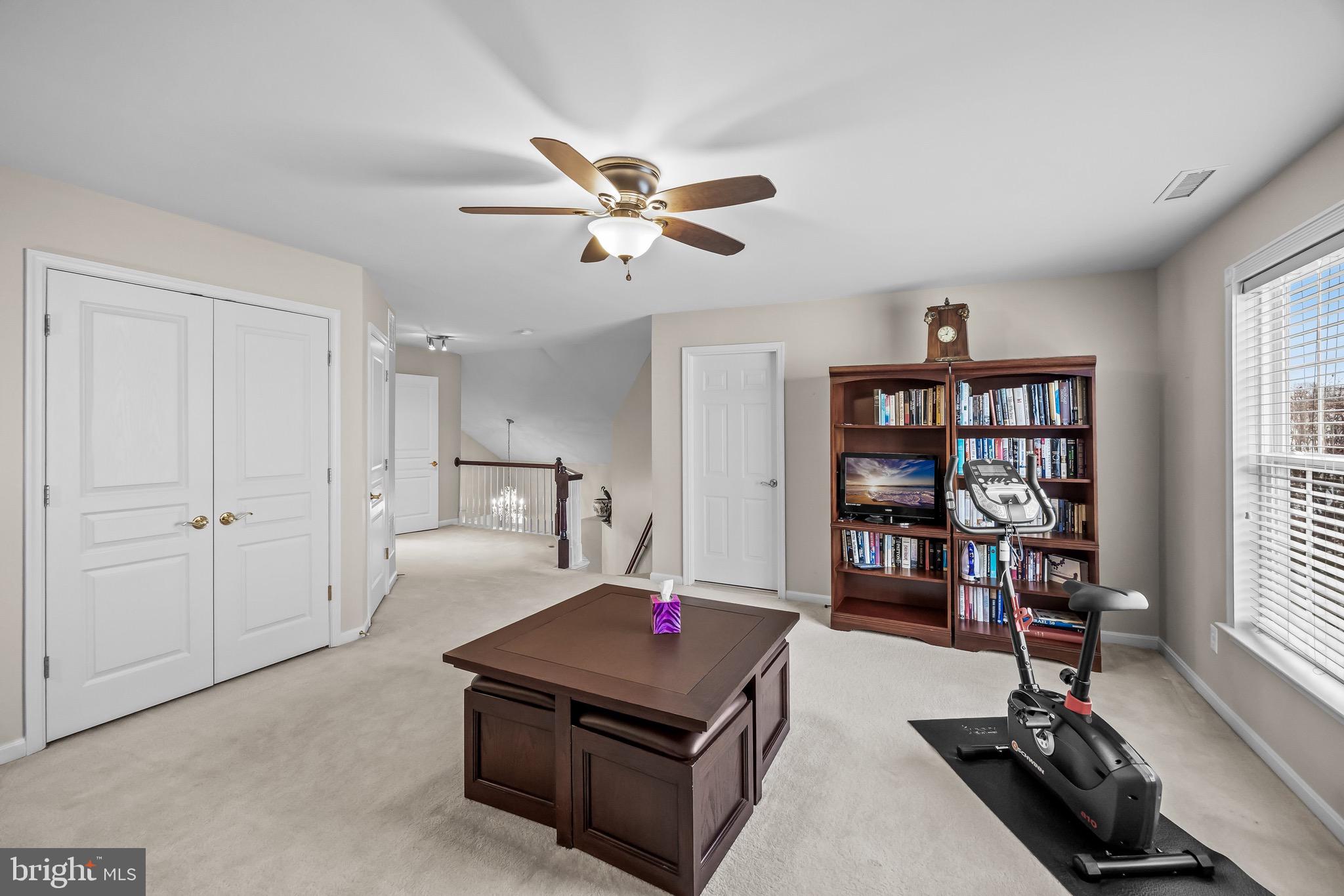 77 Pennington Court Delanco, NJ 08075 - Photo 31 of 46 a living room with furniture a bookshelf and a window