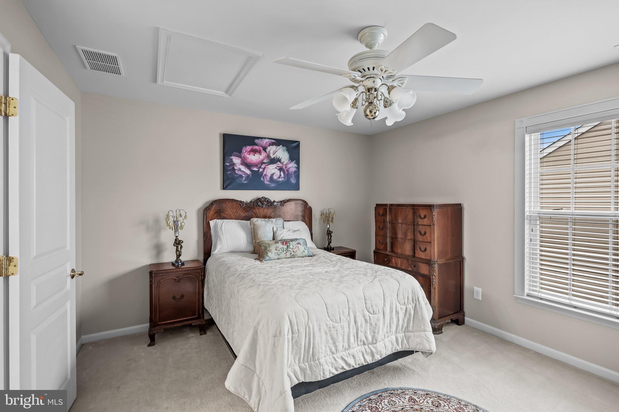 77 Pennington Court Delanco, NJ 08075 - Photo 32 of 46 a bedroom with a bed and a chandelier