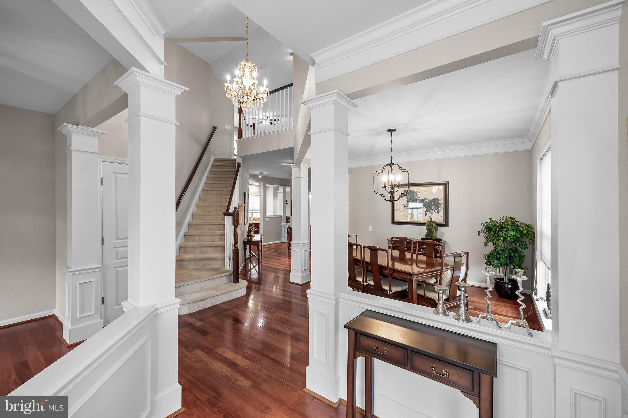 77 Pennington Court Delanco, NJ 08075 - Photo 8 of 46 a dining room with wooden floor a chandelier a wooden table and chairs