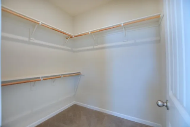 a view of an empty walk in closet