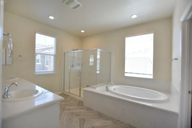 a bathroom with a bathtub and a sink