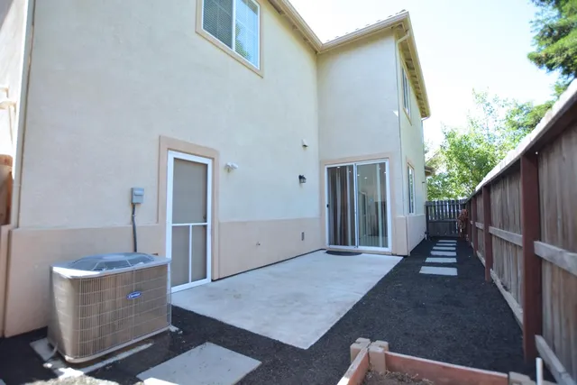 a backyard of a house with wooden floor
