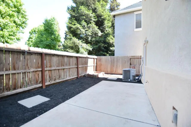 a view of a backyard from a balcony