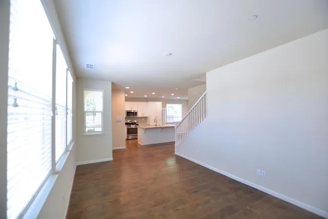 a view of a living room with windows