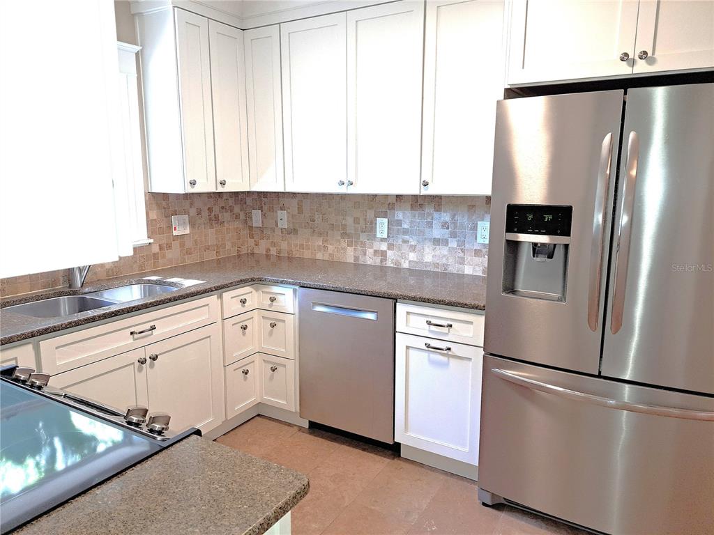 1835 Edwin Boulevard Winter Park, FL 32789 - Photo 11 of 49 a kitchen with appliances cabinets and a sink