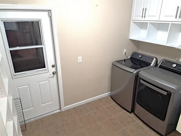 a utility room with dryer and washer