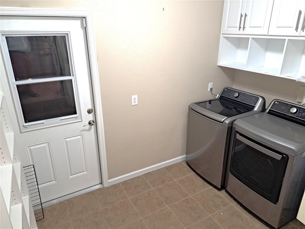 1835 Edwin Boulevard Winter Park, FL 32789 - Photo 16 of 49 a utility room with dryer and washer