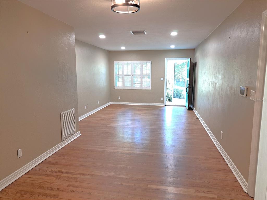 1835 Edwin Boulevard Winter Park, FL 32789 - Photo 17 of 49 an empty room with wooden floor and windows