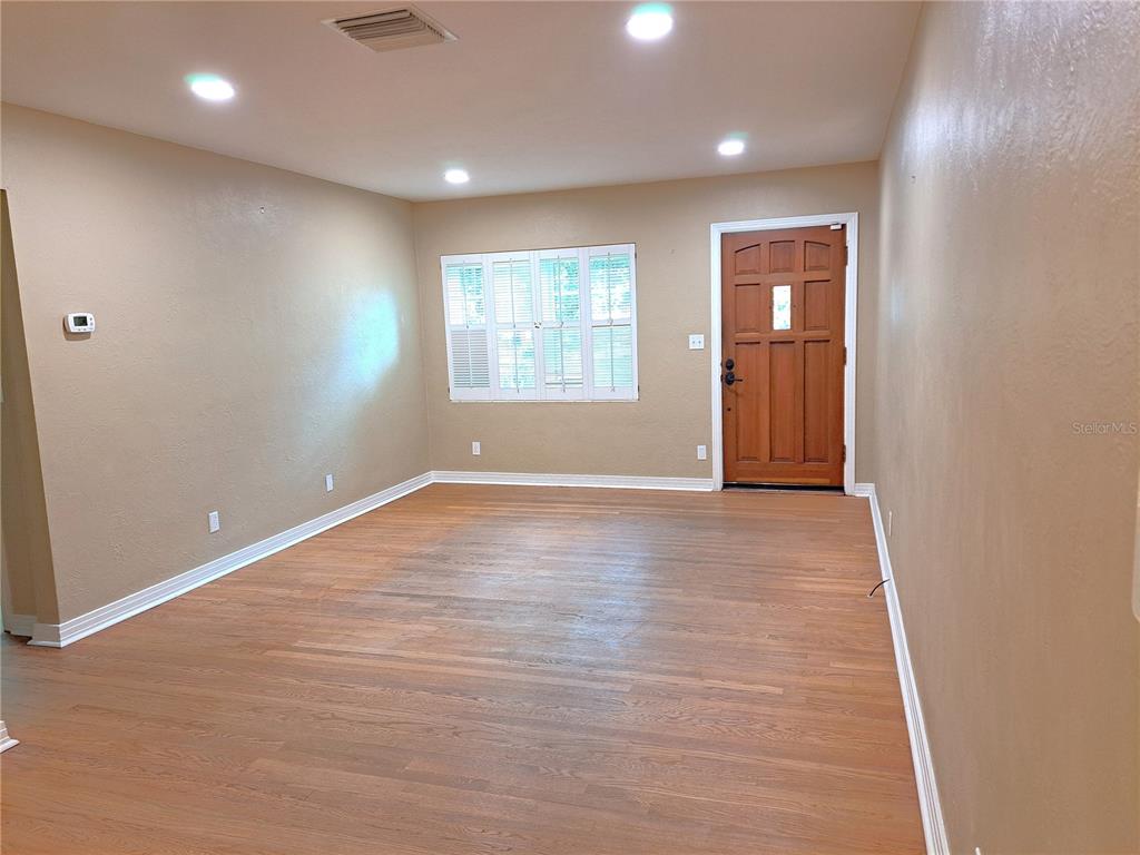 1835 Edwin Boulevard Winter Park, FL 32789 - Photo 19 of 49 an empty room with wooden floor and windows