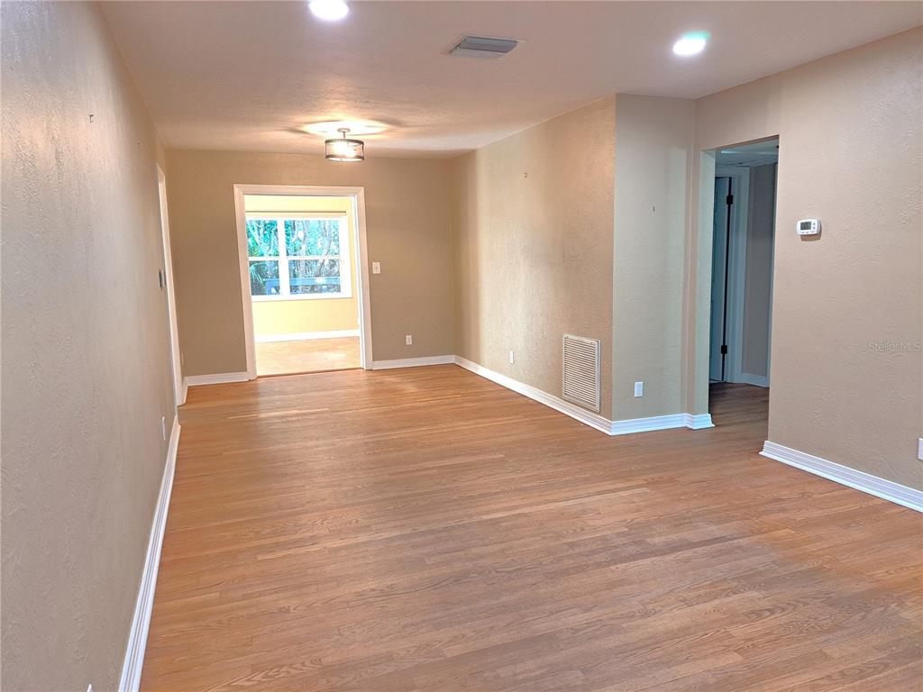 1835 Edwin Boulevard Winter Park, FL 32789 - Photo 20 of 49 wooden floor in an empty room with a window