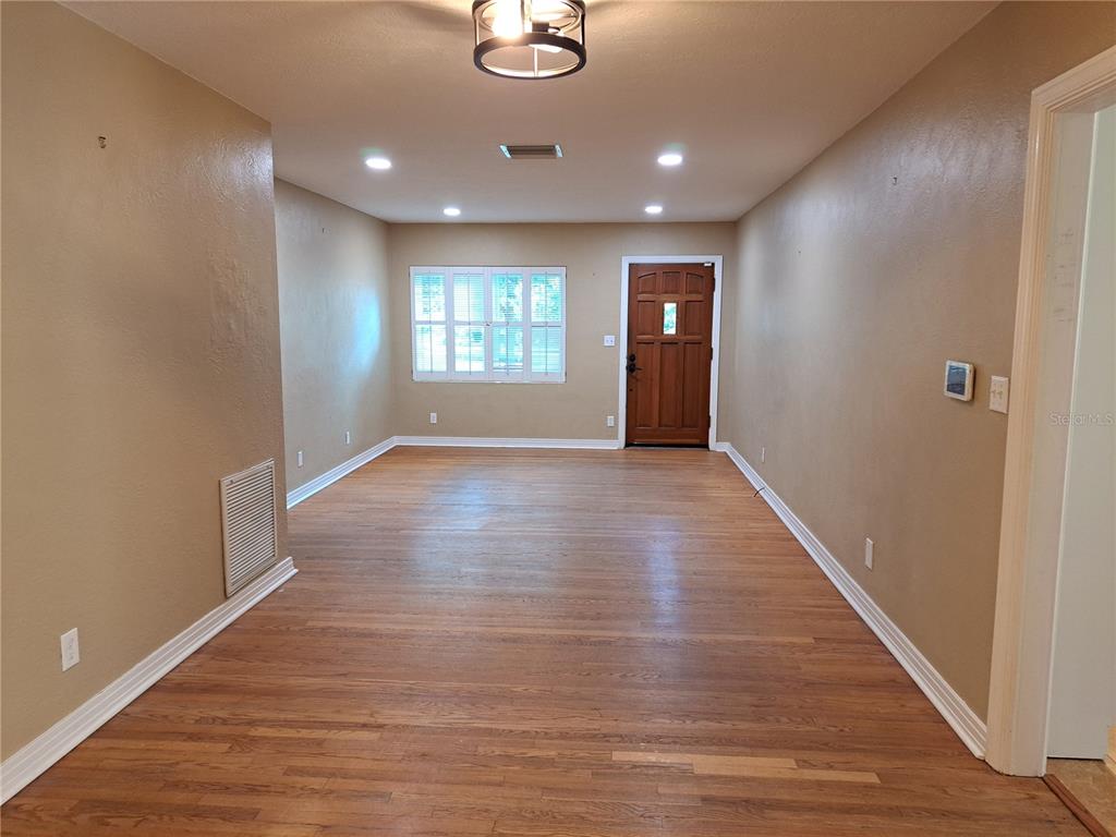 1835 Edwin Boulevard Winter Park, FL 32789 - Photo 21 of 49 wooden floor in an empty room with a window