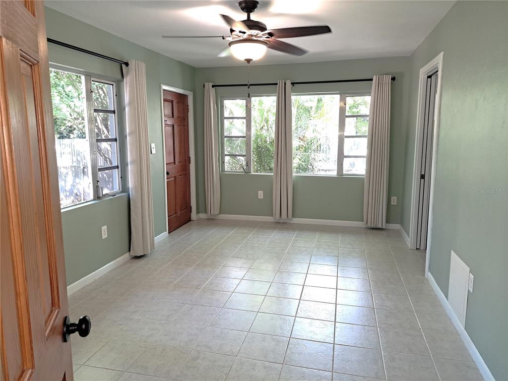 1835 Edwin Boulevard Winter Park, FL 32789 - Photo 23 of 49 a view of an empty room with window and chandelier fan
