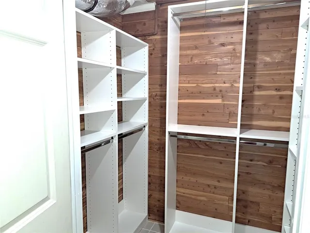 a bathroom with a shower and a glass door