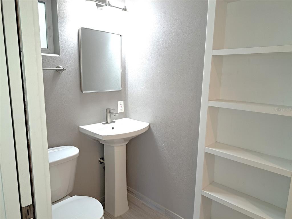 1835 Edwin Boulevard Winter Park, FL 32789 - Photo 28 of 49 a bathroom with a sink toilet and a mirror