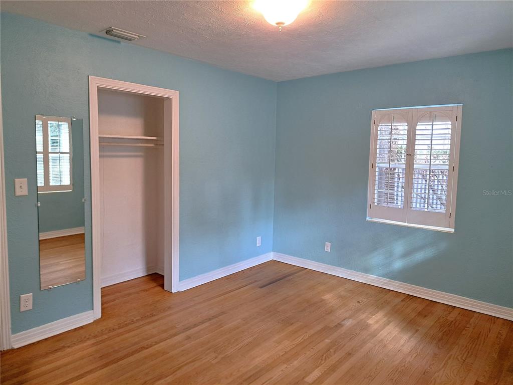 1835 Edwin Boulevard Winter Park, FL 32789 - Photo 34 of 49 an empty room with wooden floor closet and windows