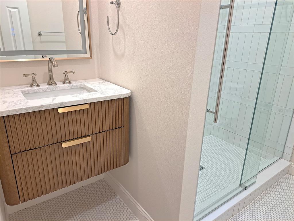 1835 Edwin Boulevard Winter Park, FL 32789 - Photo 37 of 49 a bathroom with a sink and a mirror