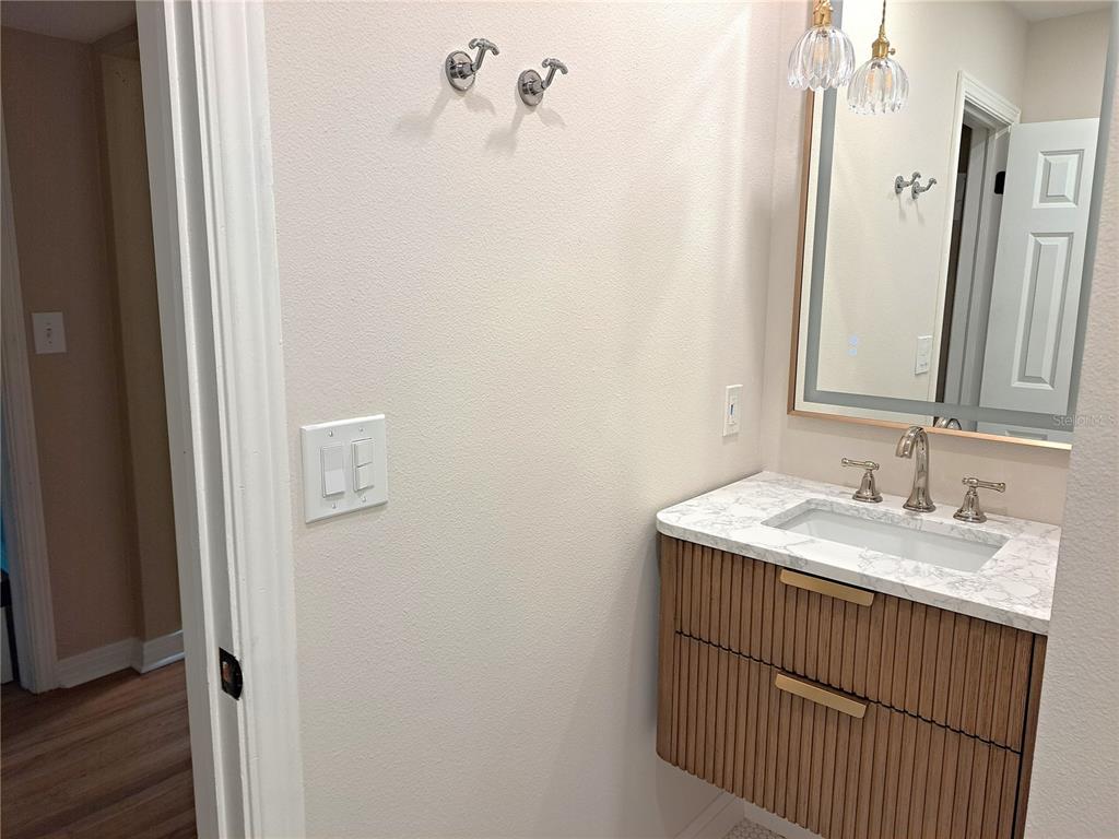 1835 Edwin Boulevard Winter Park, FL 32789 - Photo 38 of 49 a bathroom with a sink and a mirror