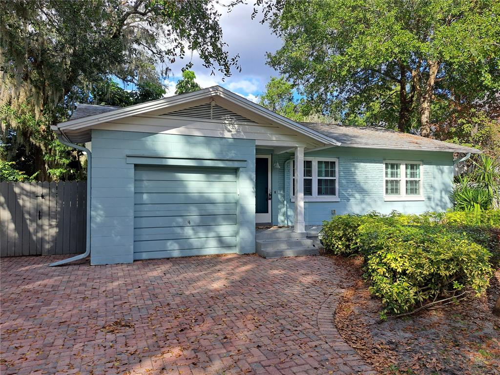 1835 Edwin Boulevard Winter Park, FL 32789 - Photo 4 of 49 a front view of house with yard and trees in the background
