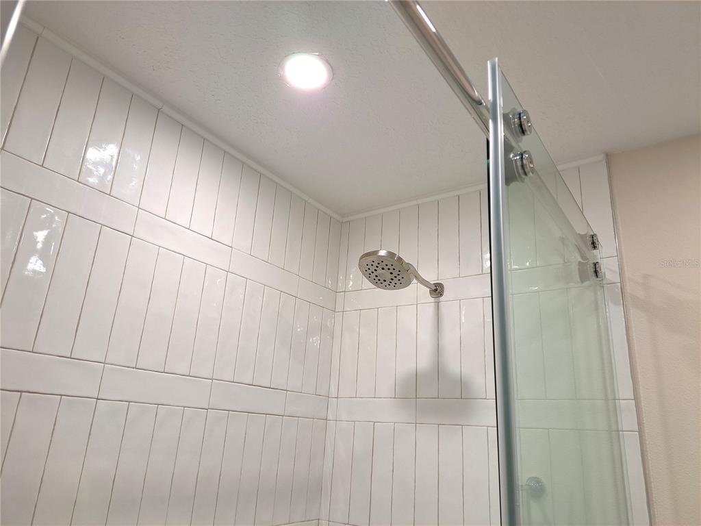 1835 Edwin Boulevard Winter Park, FL 32789 - Photo 41 of 49 a bathroom with a shower and a glass door