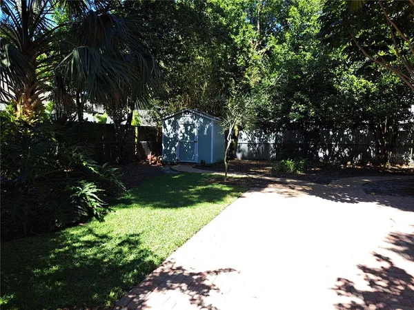 a view of house with trees in the background