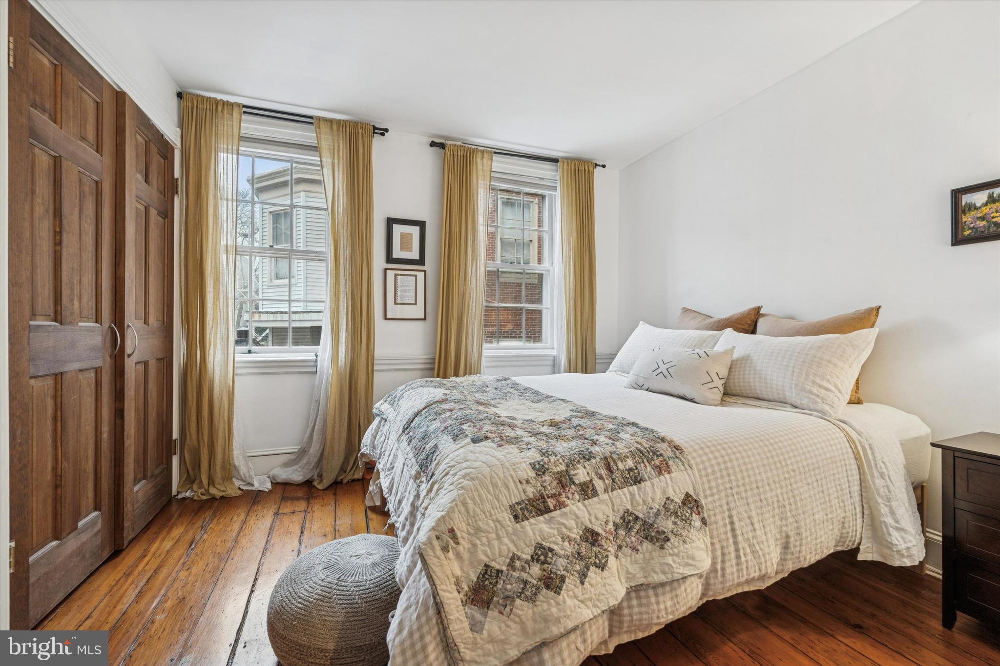 258 Quince Street Philadelphia, PA 19107 - Photo 12 of 29 a bedroom with a bed and wooden floor