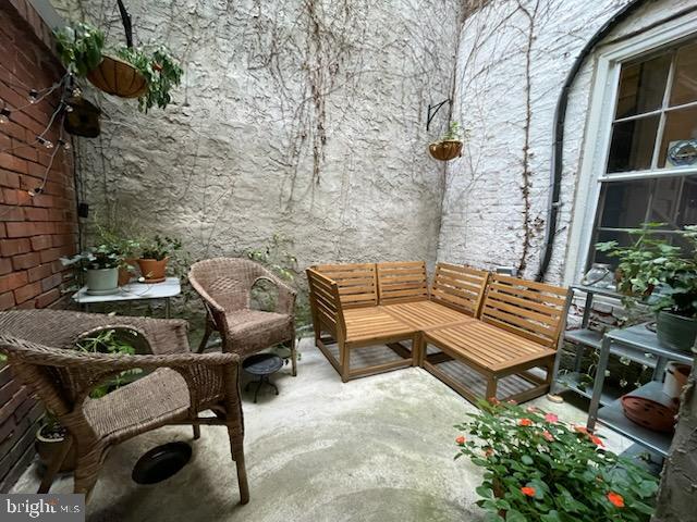 258 Quince Street Philadelphia, PA 19107 - Photo 24 of 29 a view of a chairs and table in the back yard of the house