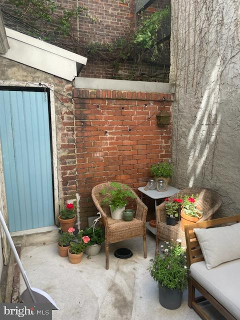 258 Quince Street Philadelphia, PA 19107 - Photo 25 of 29 a backyard of a house with outdoor seating