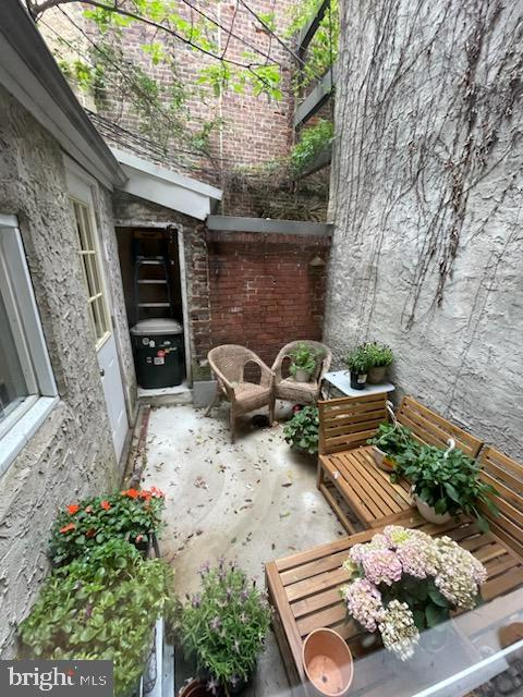 258 Quince Street Philadelphia, PA 19107 - Photo 26 of 29 a view of a backyard with plants and a patio