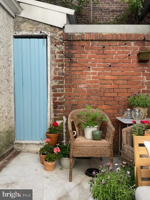 258 Quince Street Philadelphia, PA 19107 - Photo 27 of 29 a backyard of a house with outdoor seating