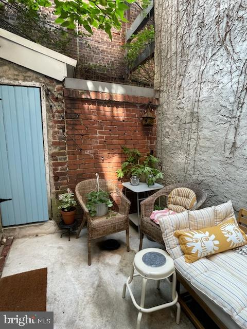 258 Quince Street Philadelphia, PA 19107 - Photo 29 of 29 a backyard of a house with fire pit and outdoor seating