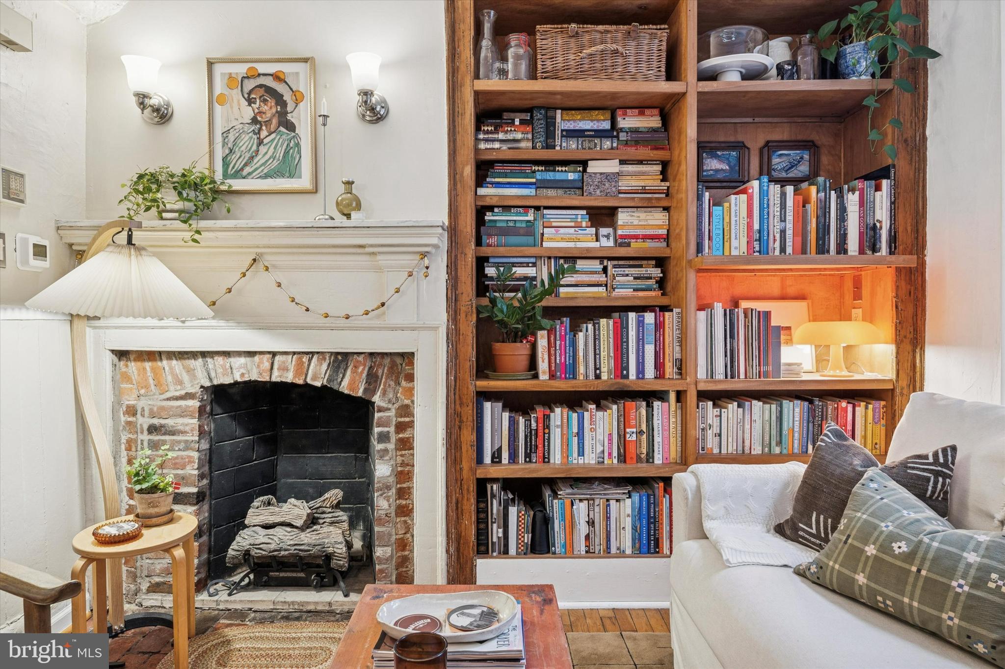 258 Quince Street Philadelphia, PA 19107 - Photo 5 of 29 a living room with bookshelf and a fireplace