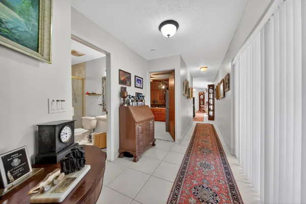 a large kitchen with stainless steel appliances granite countertop a sink and cabinets