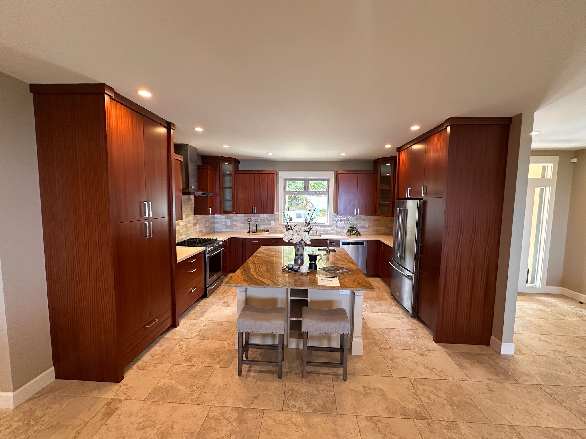 75-2620 Keopu Lani Road Holualoa, HI 96725 - Photo 14 of 30 a kitchen with stainless steel appliances a refrigerator and a wooden cabinets