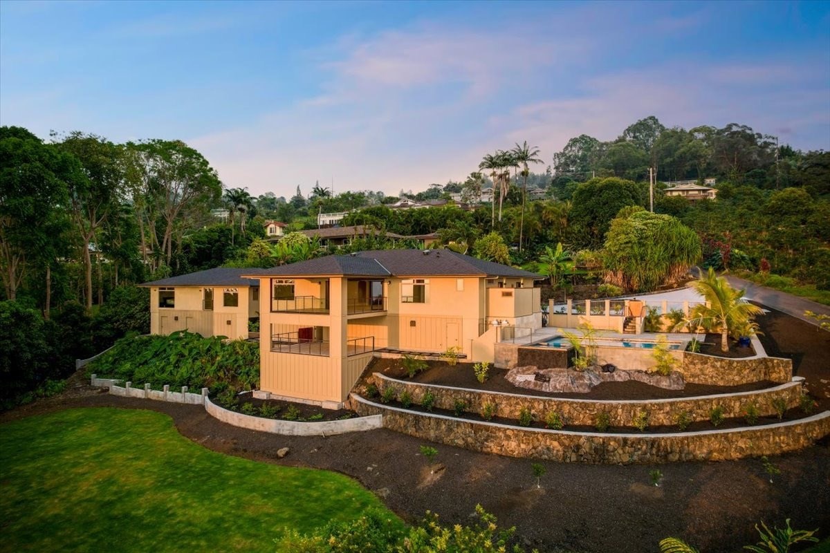 75-2620 Keopu Lani Road Holualoa, HI 96725 - Photo 2 of 30 a view of a house with a yard fire pit and outdoor seating