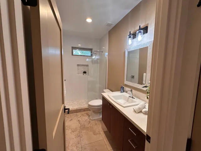 a utility room with a sink washer and dryer