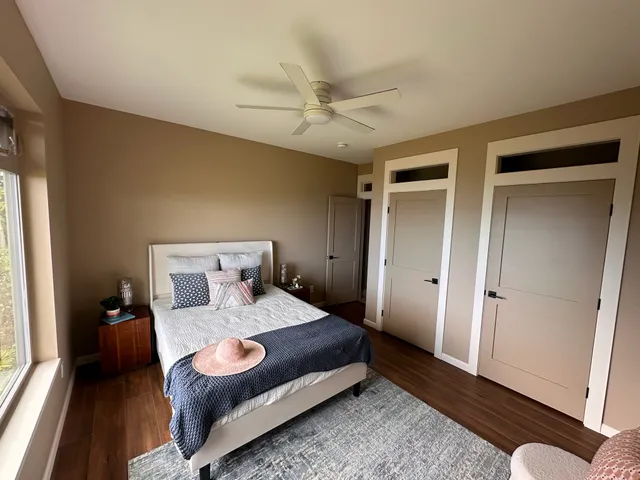 a large bathroom with a double vanity sink and a toilet
