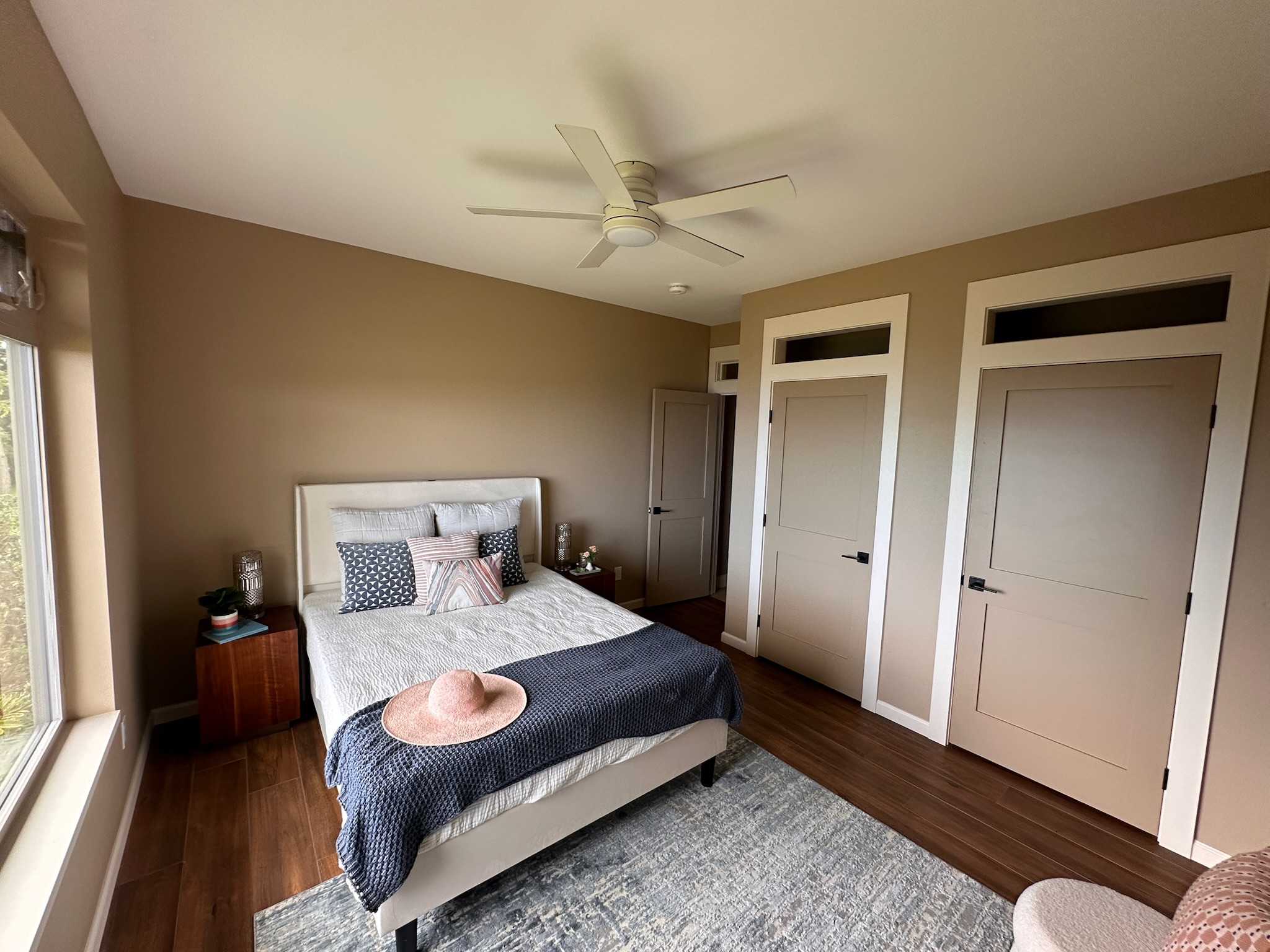 75-2620 Keopu Lani Road Holualoa, HI 96725 - Photo 25 of 30 a bedroom with a bed and a dresser next to a window