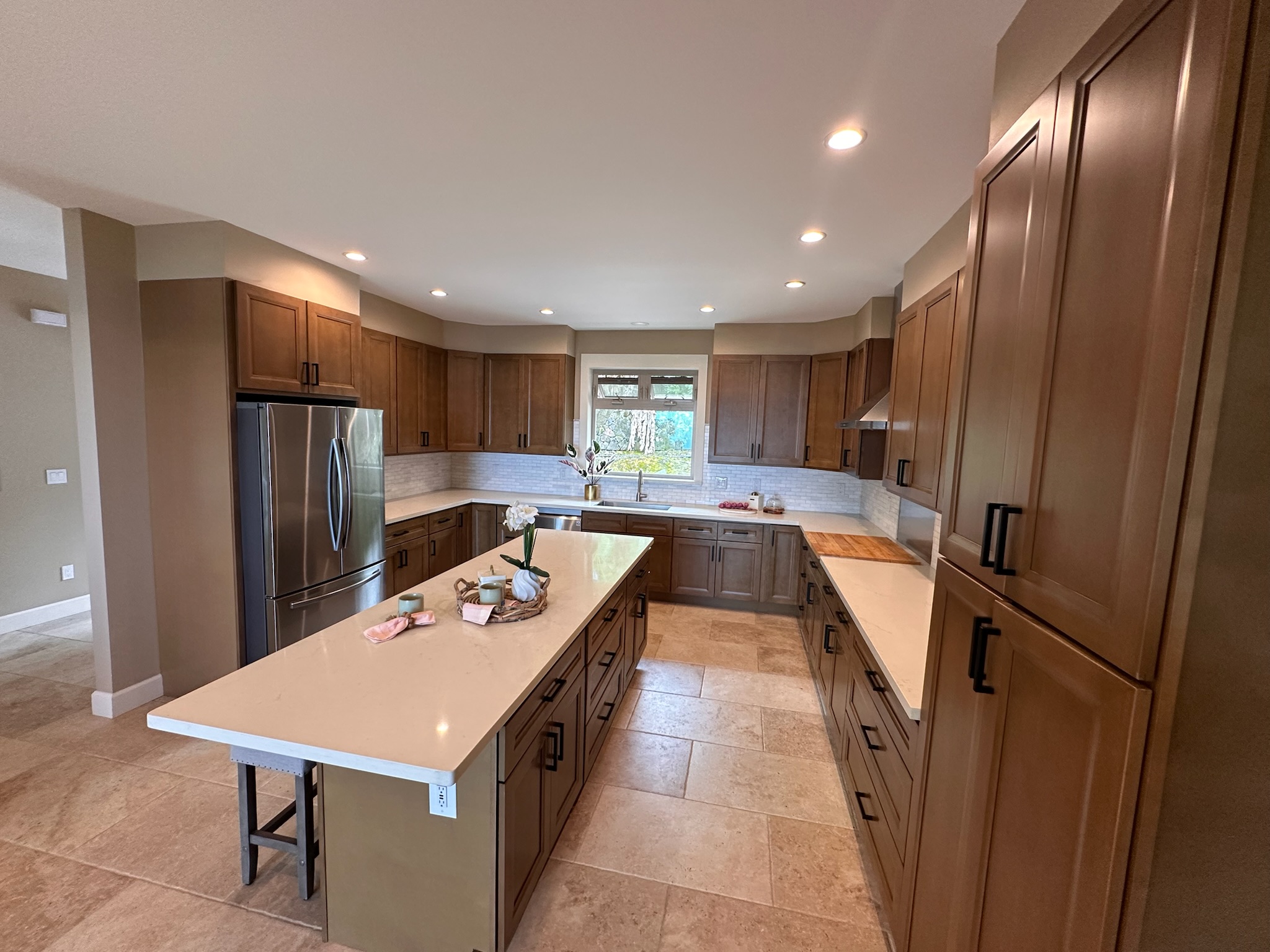 75-2620 Keopu Lani Road Holualoa, HI 96725 - Photo 29 of 30 a kitchen with stainless steel appliances granite countertop a refrigerator a sink a stove and wooden cabinets