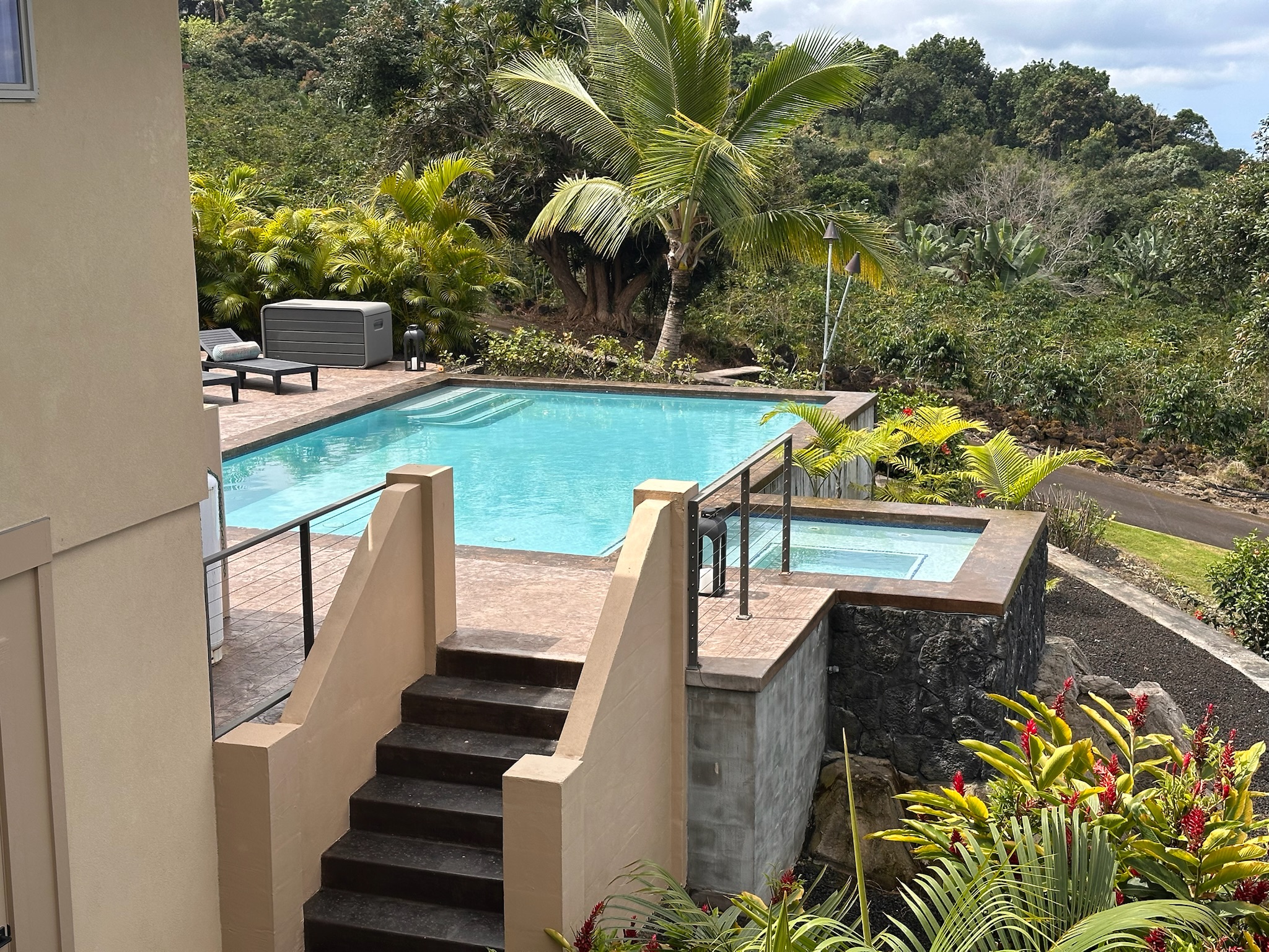75-2620 Keopu Lani Road Holualoa, HI 96725 - Photo 4 of 30 a view of a balcony with two chairs and a table