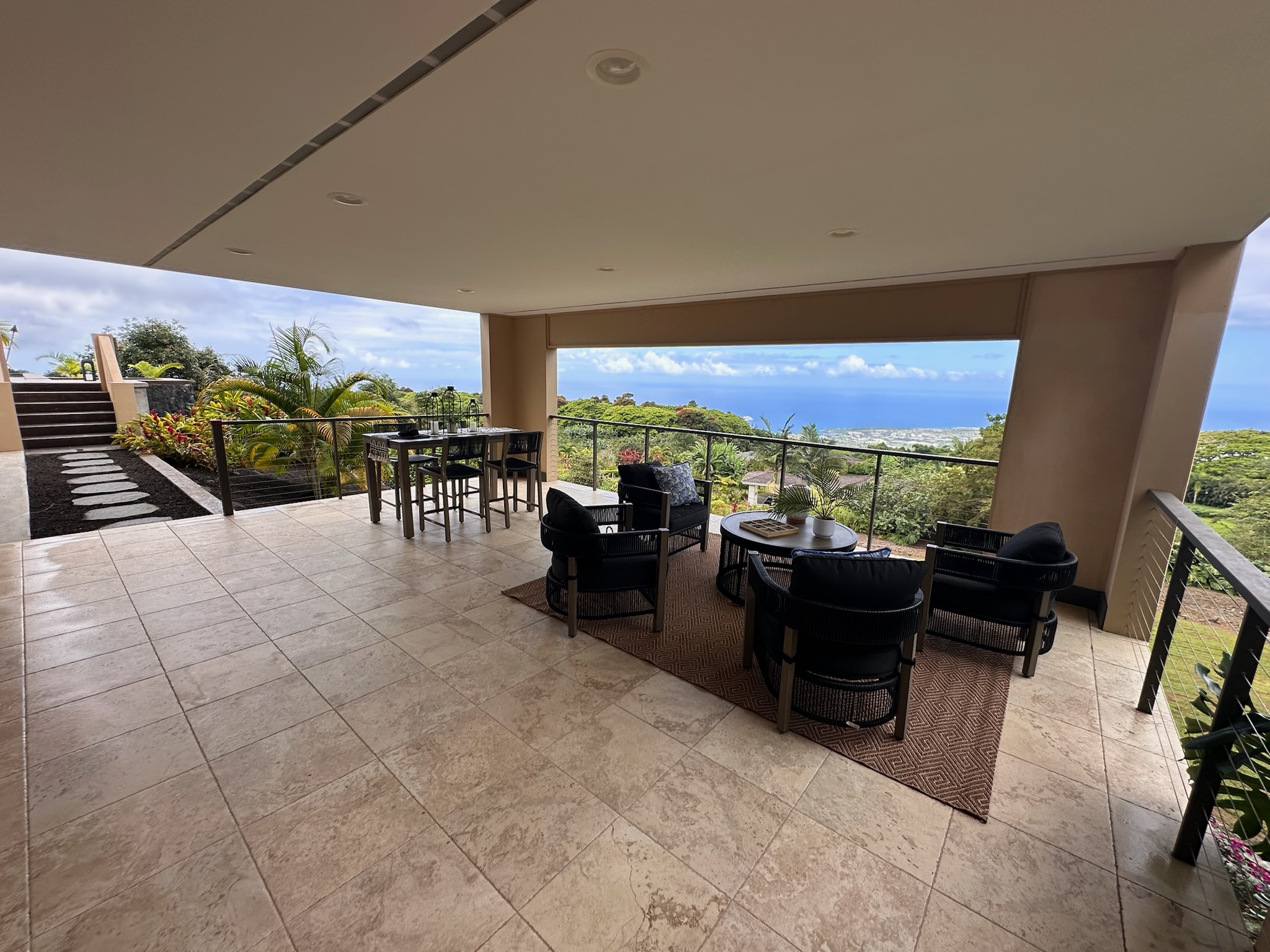 75-2620 Keopu Lani Road Holualoa, HI 96725 - Photo 5 of 30 a living room with couches and a flat screen tv