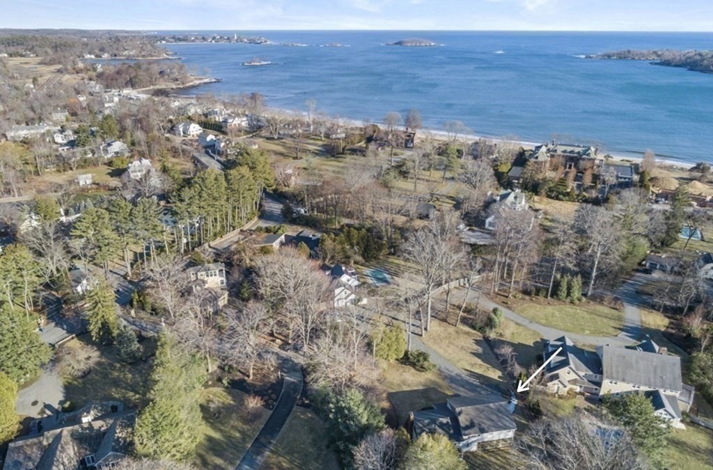 an aerial view of house with yard and mountain in back