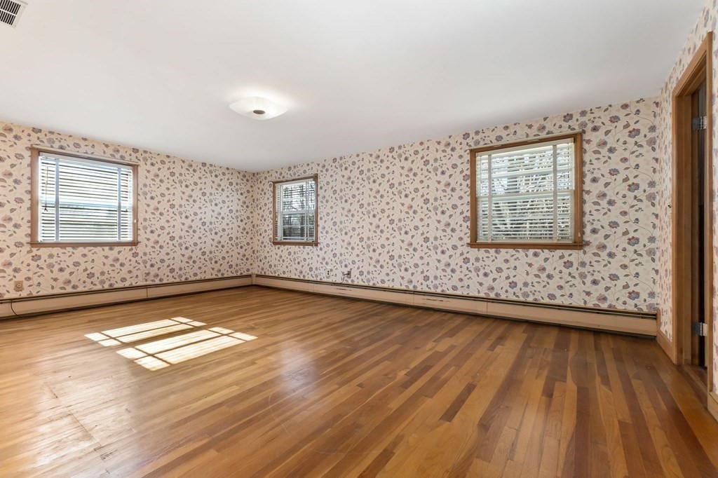11 Haven Way Beverly, MA 01915 - Photo 12 of 29 an empty room with wooden floor and windows