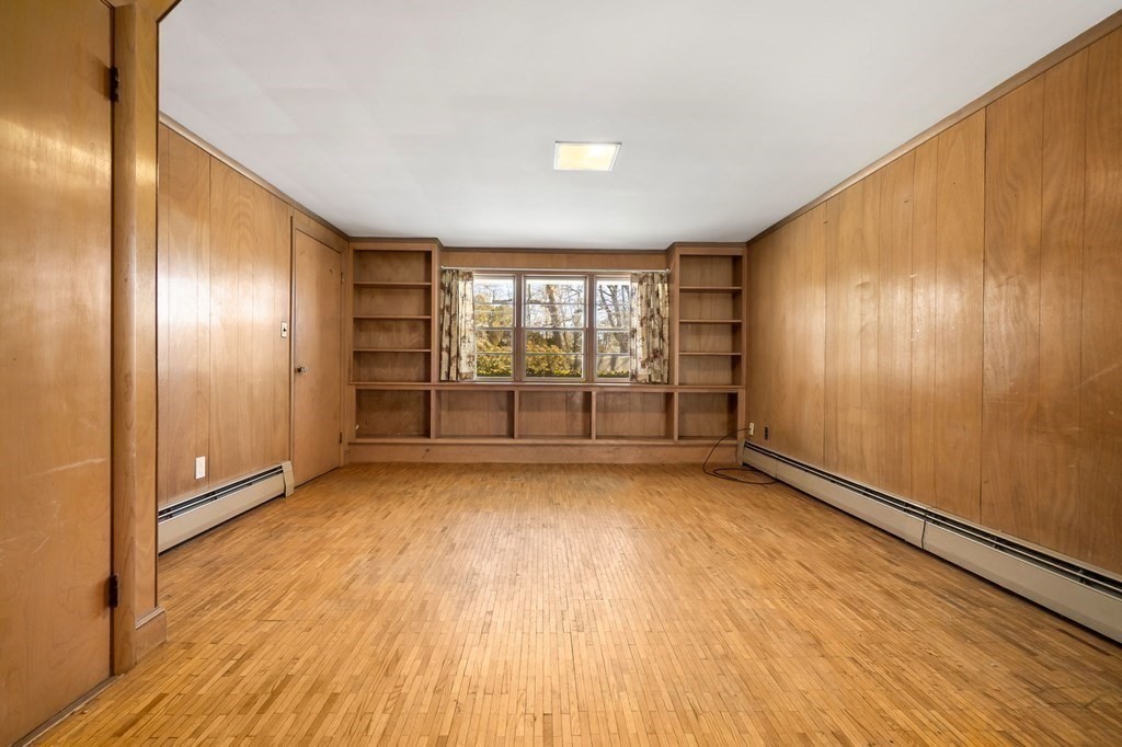 11 Haven Way Beverly, MA 01915 - Photo 19 of 29 an empty room with wooden floor and windows