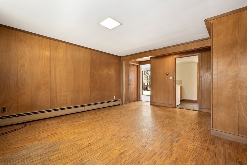 11 Haven Way Beverly, MA 01915 - Photo 20 of 29 a view of an empty room with wooden floor and a window