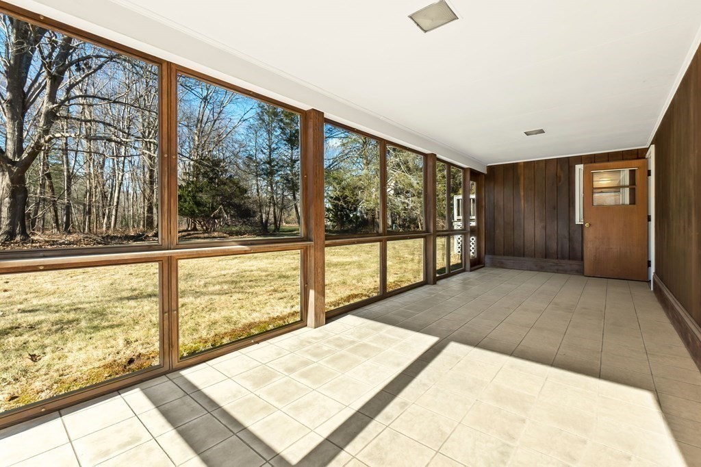 11 Haven Way Beverly, MA 01915 - Photo 22 of 29 a view of an empty room with wooden floor and a window