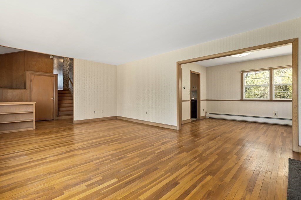 11 Haven Way Beverly, MA 01915 - Photo 7 of 29 an empty room with wooden floor and windows