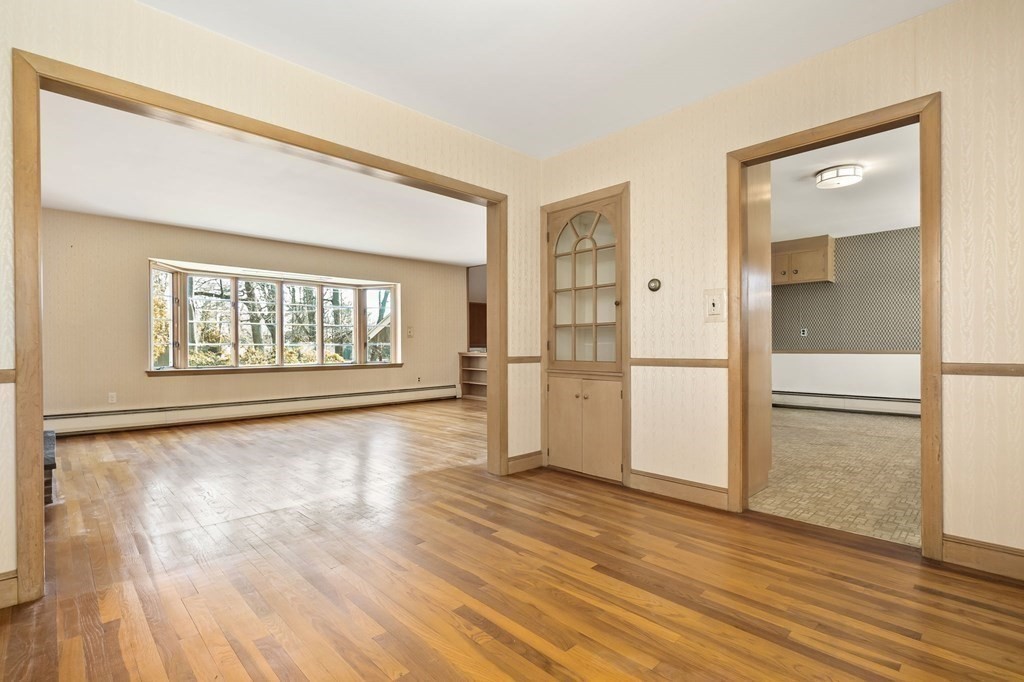 11 Haven Way Beverly, MA 01915 - Photo 8 of 29 a view of an empty room with wooden floor and a window