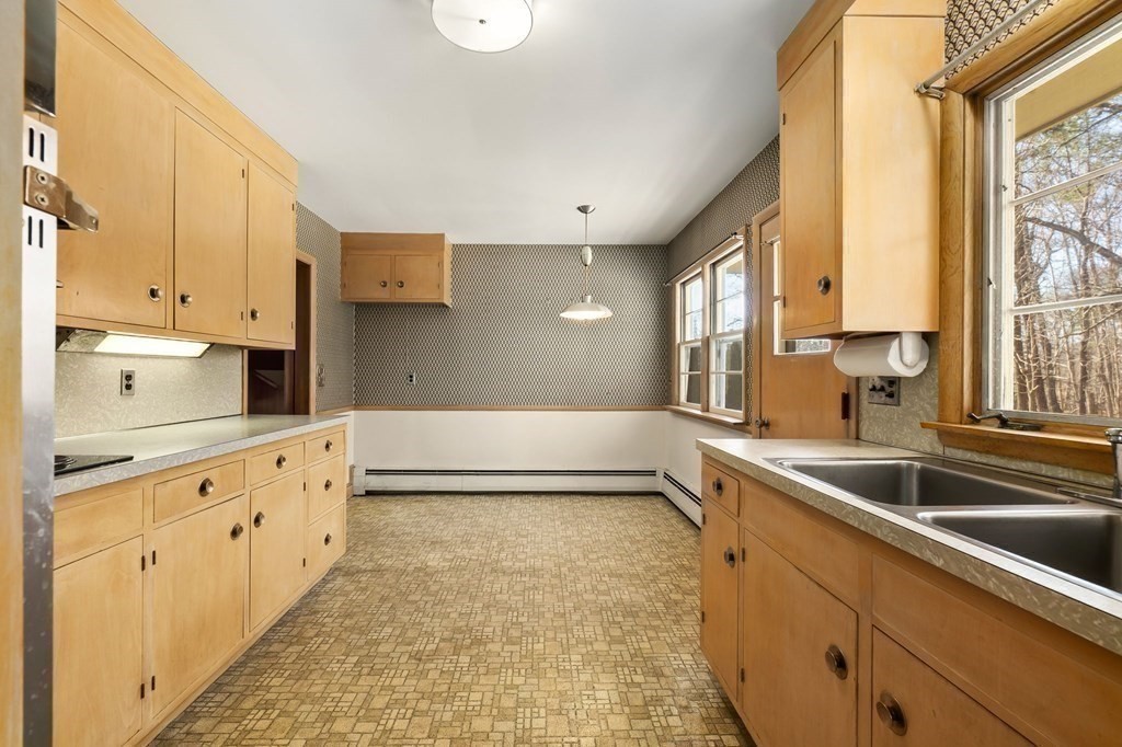 11 Haven Way Beverly, MA 01915 - Photo 10 of 29 a kitchen with granite countertop a sink and white cabinets