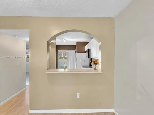 a bathroom with a granite countertop toilet a sink and a bathtub