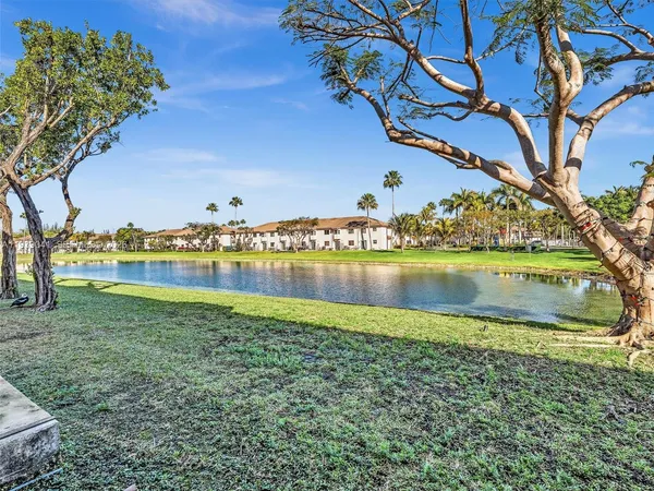 a view of a lake with houses in the back